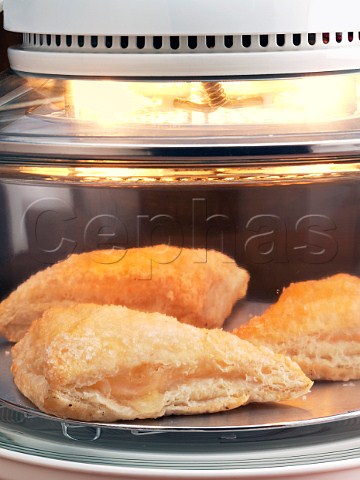 Apple turnovers cooking in a halogen oven