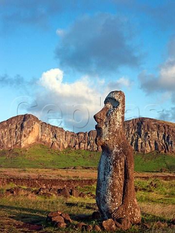 Moai at the entrance to Ahu Tongariki with Rano Raraku volcano in the distance Easter Island