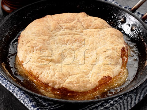 Apple pie cooking in pan