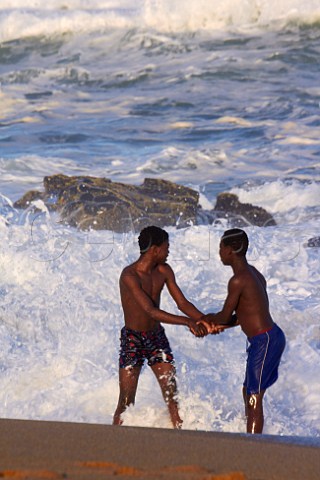 Boys playing in the sea at Amanzimtoti KwaZuluNatal South Africa