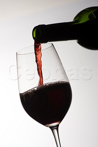 Pouring a glass of Bordeaux wine
