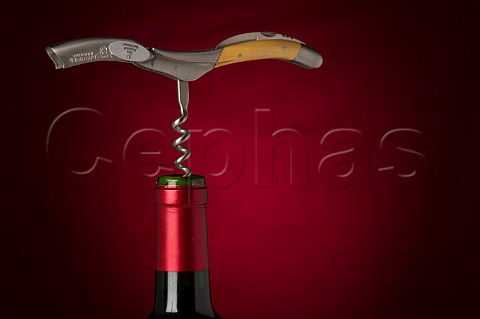 Laguiole corkscrew and bottle of wine