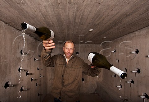 Grant Phelps winemaker of Casas del Bosque pouring his Sauvignon Blanc in the wine cellar in the event house  Casablanca Valley Chile