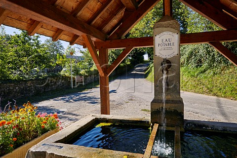 Drinking water fountain in the wine village of MontignylsArsures Jura France Arbois