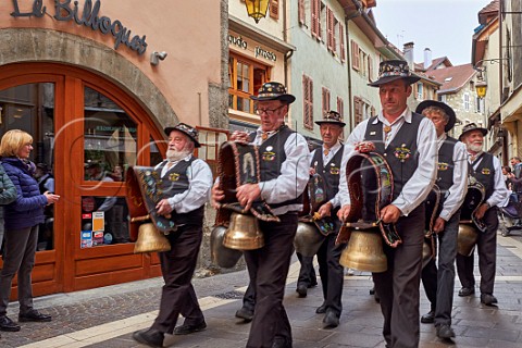 Group of men ringing cow bells during the Retour des Alpages festival Annecy HauteSavoie France