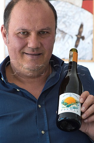 Stefano Chiarlo of Michele Chiarlo with a bottle of his Moscato dAsti Nivole Piemonte Italy