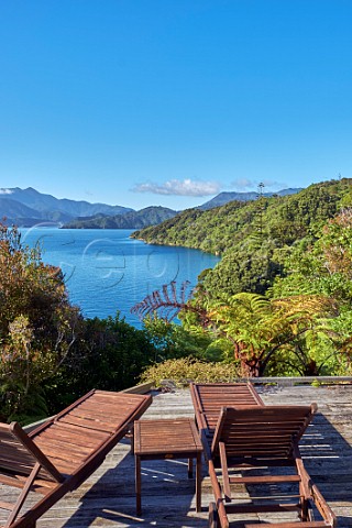 Sun loungers on a terrace above Double Cove Marlborough Sounds Marlborough New Zealand