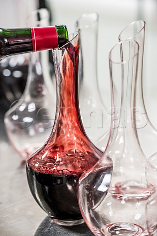 Pouring red wine into a decanter during an event at Chteau Pavie  Stmilion Gironde France  Saintmilion  Bordeaux