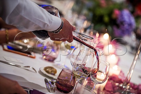 Pouring red wine from a decanter during an event at Chteau Pavie  Stmilion Gironde France  Saintmilion  Bordeaux