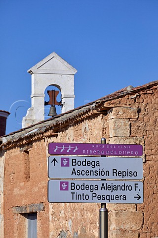 Signs to wineries by traditional building on the Ruta del Vio in Pesquera de Duero Castilla y Len Spain  Ribera del Duero