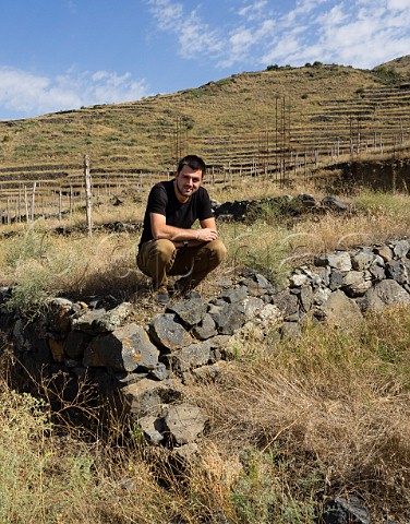 Giorgi Natenadze in one of his ancient stoneterraced vineyards which he is replanting Khizabavra Valley Georgia