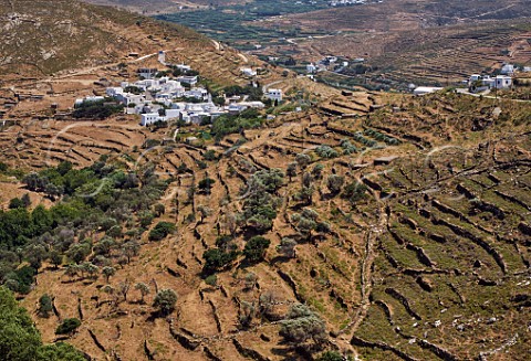 Village of Aetofolia surrounded by old stone terraces Tinos Greece