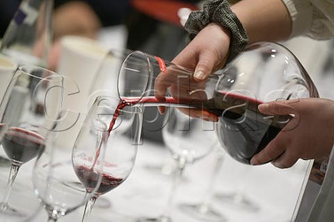 Pouring red wine from a decanter  Vinexpo Paris 2022 Expo Porte de Versailles Paris France