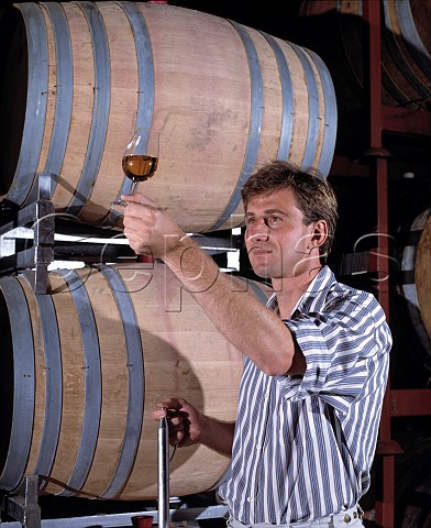 Darren de Bortoli winemaker circa 1990 with his Botrytised   Semillon   De Bortoli Wines Griffith   New South Wales Australia  Riverina