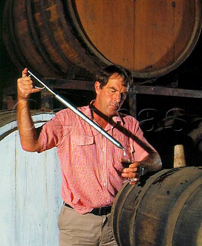 Colin Campbell examines the progress of his   Rutherglen Muscat maturing in barrel Campbells   Winery Rutherglen Victoria CorowaRutherglen