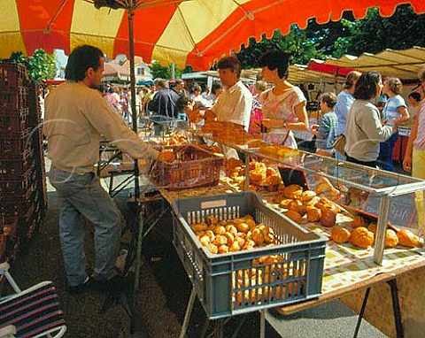 Selling buns on a market stall in   La FertsousJouarre SeineetMarne France