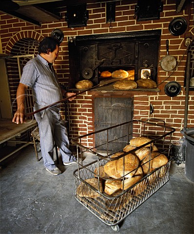 Bread being baked in woodfired oven   La Roquette near Perigueux Dordogne France