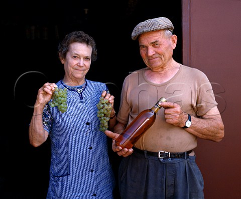 Louis Vergne and his wife Odette with the   Monbazillac wine which they make from their   Semillon grapes  Monbazillac Dordogne France  Monbazillac   Bergerac