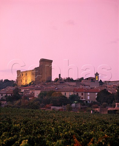 Dusk falls over ChteauneufduPape and the ruins of   the papal chteau which dominate the town     Vaucluse France
