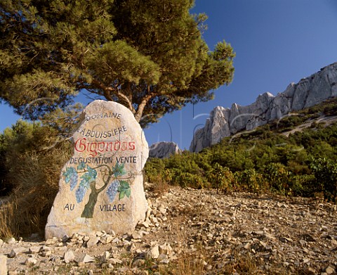 Marker stone by vineyard of Domaine la Bouissire below the Dentelles de Montmirail Gigondas Vaucluse France  AC Gigondas