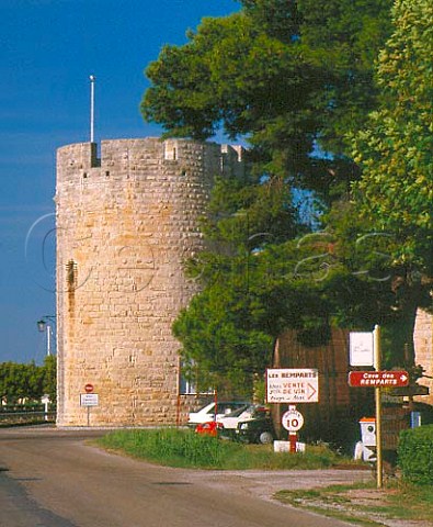 Entrance to the cooperative winery Les Remparts   with part of the old town walls beyond   AiguesMortes Gard France