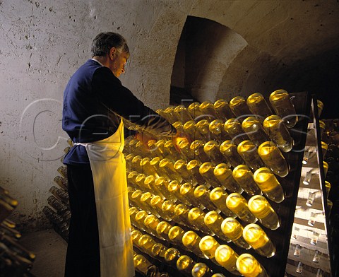 Performing the remuage on bottles of Cristal   champagne in the cellars of Louis Roederer   Reims Marne France