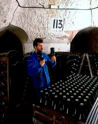 Champagne Veuve ClicquotPonsardin Shaking bottles   of La Grande Dame before putting in pupitres to   undergo the remuage The cellars are in the old   GalloRoman chalk quarries of Reims