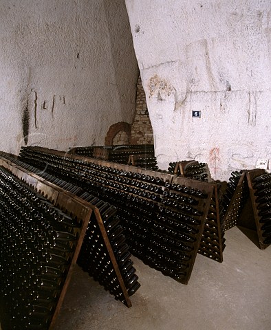 Pupitres of champagne in the cellars of  Charles Heidsieck in one of the old GalloRoman   chalk quarries of Reims Marne France