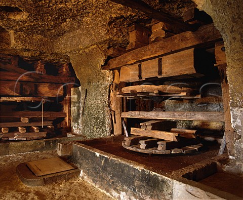Ancient presses in Le Mont cellars of Gaston Huet   The cellars are hewn out of the tuffeau subsoil and   are below the vineyard of the same name   Vouvray IndreetLoire France