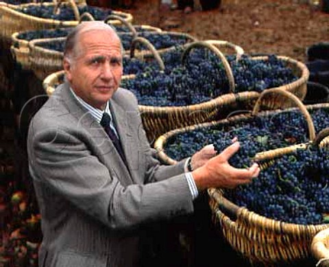 Louis Latour with baskets of Pinot Noir grapes from   Les Perrieres vineyard around his Chateau de Grancey   at AloxeCorton  Cote de Beaune