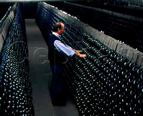 Performing the remuage on bottles of Cremant de   Limoux in the cellars of Les Caves du Sieur dArques   Limoux Aude France
