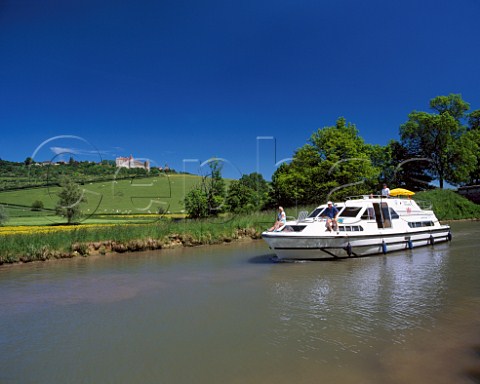 Boat on the Canal de Bourgogne below village of ChteauneufenAuxois Cte dOr France Burgundy