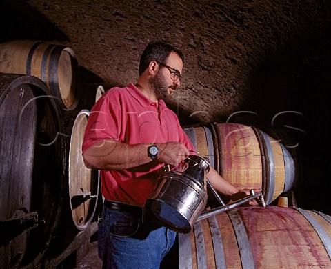 Maitre de Chai Philippe Brun topping up barrels  a   process known as ouillage Domaine Bruno Clair MarsannaylaCte CtedOr France