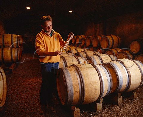 Dominique Lafon taking a sample of his Clos de la   Barre from barrel in the cellars of Domaine des   Comtes de Lafon Meursault Cte dOr France       Cte de Beaune