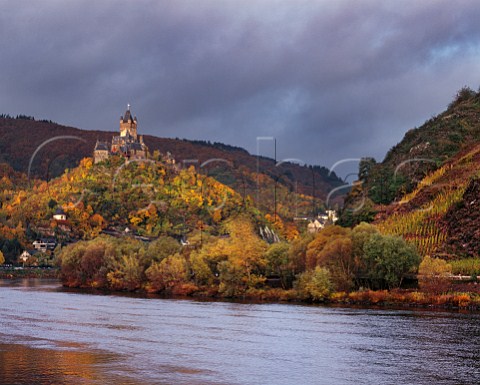 Stormy light on Reichsburg castle and the Mosel River at Cochem The Nikolausberg vineyard on right is at the end of a south facing slope where the river unusually flows due west   Cochem Germany