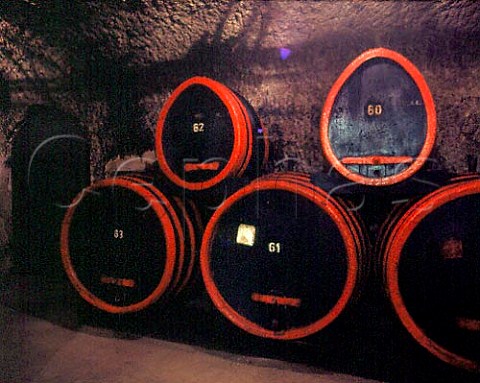 Old oak casks in the cellars of Egervin which have    been tunnelled out of the soft tufa of the hills   Eger Hungary