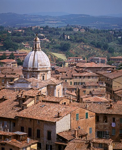 View over the rooftops of Siena to the surrounding   countryside from the bell tower of the town hall    Tuscany Italy