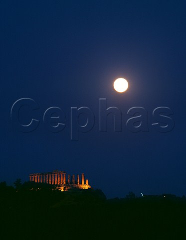 Full moon above the Temple of Giunone Valley of Temples Agrigento Sicily Italy