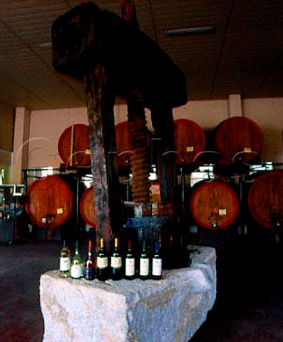 Some of Firriatos range of wines standing on an old   press in their barrel room   Paceco Trapani province Sicily
