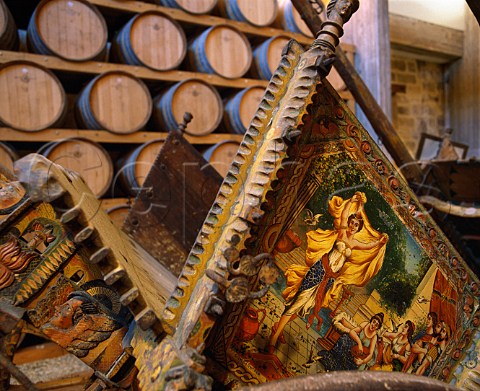 French oak barriques and traditional Sicilian carts   carretti  dating from 1850 in the cellars of Carlo   Pellegrino Marsala Sicily