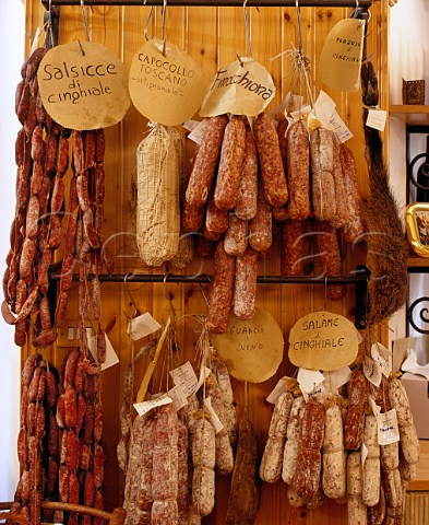 Salami sausages and prosciutto  some made from wild boar cinghiale  on sale in La Bottega del Naturista Pienza Tuscany Italy