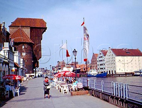 The Crane Gate and across the Motlawa River the   three restored granaries which form part of the   Central Maritime Museum complex Gdansk Poland