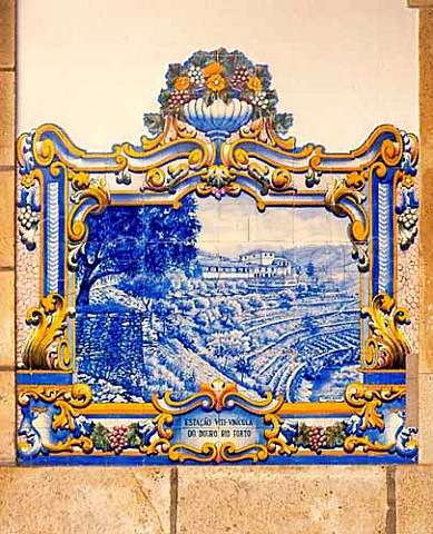 Traditional azulejo tiled mural on the wall of Pinhao railway station in the Douro valley Portugal 