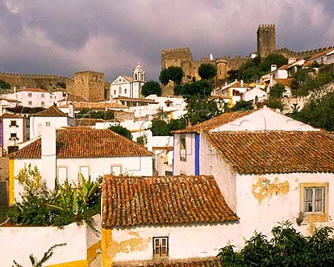 The walled town of Obidos Estremadura Portugal Known as The   Wedding City it was the traditional bridal gift of   the kings of Portugal to their queens a custom begun in 1282 by Dom Dinis and Dona Isabella