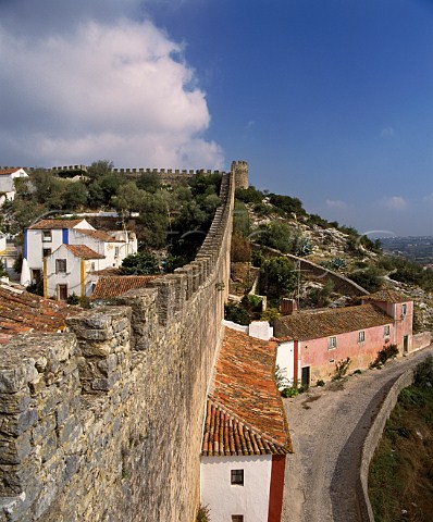 The walled town of Obidos Estremadura Portugal Known as The Wedding City it was the traditional bridal gift of the kings of Portugal to their queens a custom begun in 1282 by Dom Dinis and Dona Isabella