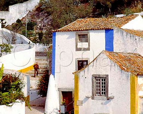 Painted houses In the walled town of ObidosEstremadura Portugal  Known as The Wedding Cityit was the traditional bridal gift of the kings ofPortugal to their queens a custom begun in 1282 byDom Dinis and Dona Isabella