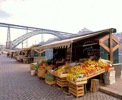 Vegetable stall along the Cais da Ribeira the   waterfront area of Porto by the Douro River    Ponte de Dom Luis I is beyond   Portugal