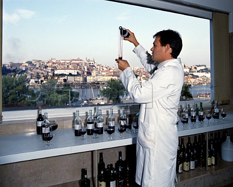 Oenologist Luis de Sottomayor blending Quinta da Porto 10year old port in laboratory of Ferreira overlooking Porto and the Douro River   Portugal