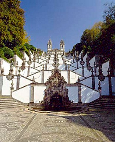 The church of Bom Jesus do Monte situated at the topof its vast ornamental staircase of white plasterand granite Cut into the side of a densely woodedhill high above the city of Braga it was created atthe beginning of the 18thcentury by Bragasarchbishop It is now a place of pilgrimage  Portugal