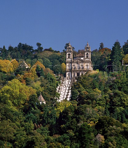 The church of Bom Jesus do Monte at the top of its vast Baroque staircase of white plaster  and granite cut into the side of a densely wooded  hill high above Braga Minho Portugal